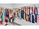 Walk-in closet with clothing racks filled with colorful clothes at 14812 Boulder Pass Pl, Wimauma, FL 33598