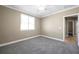 Neutral bedroom with new carpet, ceiling fan, white trim, and a window at 15714 Ibisridge Dr, Lithia, FL 33547