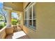 Charming porch area with decorative columns and a view of the surrounding neighborhood landscape at 15714 Ibisridge Dr, Lithia, FL 33547