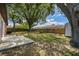 Large backyard with mature trees, shed, and partial fence at 16039 Frost Dr, Hudson, FL 34667