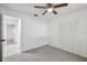 This bedroom offers ample closet space and a ceiling fan for comfort at 16039 Frost Dr, Hudson, FL 34667