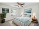 Cozy bedroom with stylish decor, large windows, and comfortable furnishings at 16039 Frost Dr, Hudson, FL 34667
