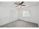 Bright bedroom with carpet flooring, closet, and a window with natural light at 16039 Frost Dr, Hudson, FL 34667