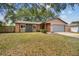 Charming single-story home with a well-manicured lawn and inviting curb appeal at 16039 Frost Dr, Hudson, FL 34667