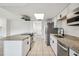 Updated kitchen with stainless steel appliances, granite countertops and tile flooring at 16039 Frost Dr, Hudson, FL 34667