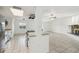 Bright kitchen with stainless steel appliances, granite countertops and a pass-through to the living area at 16039 Frost Dr, Hudson, FL 34667