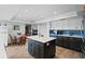 Renovated kitchen with modern appliances, central island, tile backsplash and breakfast nook at 1800 Salem Ct, Dunedin, FL 34698