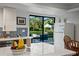 Modern kitchen with views of the pool and outdoor gazebo from the countertop at 1800 Salem Ct, Dunedin, FL 34698