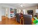 Inviting living room features hardwood floors, bookshelves, and comfortable seating at 1800 Salem Ct, Dunedin, FL 34698