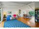 Spacious living room featuring hardwood floors, vaulted ceilings, and plenty of natural light at 1800 Salem Ct, Dunedin, FL 34698