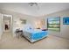 Cozy main bedroom featuring a calming color scheme and a bright window with views of the outside at 1800 Salem Ct, Dunedin, FL 34698