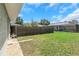 A sprawling backyard with lush green grass and a well-maintained fence at 1881 Stancel Dr, Clearwater, FL 33764