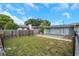 Expansive backyard with a sparkling swimming pool and ample green space for outdoor activities at 1881 Stancel Dr, Clearwater, FL 33764