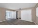Bedroom with neutral carpet, closet and sliding glass doors allowing for lots of natural light at 1881 Stancel Dr, Clearwater, FL 33764