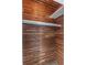 Walk in closet features cedar plank walls, shelf and hanging rod at 1881 Stancel Dr, Clearwater, FL 33764