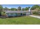Well-maintained single-story home with a manicured front lawn and an attached garage at 1881 Stancel Dr, Clearwater, FL 33764
