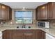 Well-equipped kitchen with a double stainless steel sink and plenty of granite counter space at 1881 Stancel Dr, Clearwater, FL 33764