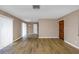 Spacious living room featuring hardwood floors, a front door, and neutral walls at 1881 Stancel Dr, Clearwater, FL 33764
