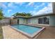 Backyard view showcasing the pool, backyard and exterior of the home at 1881 Stancel Dr, Clearwater, FL 33764