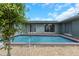 Inviting backyard pool with plenty of space for relaxing and enjoying the outdoors at 1881 Stancel Dr, Clearwater, FL 33764