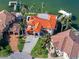 An aerial view shows the property's prime waterfront location, lush landscaping, and stylish design at 1901 Carolina Ne Ave, St Petersburg, FL 33703