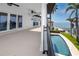 A covered balcony leads to a lovely blue swimming pool and has amazing water views at 1901 Carolina Ne Ave, St Petersburg, FL 33703