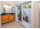 Bright bathroom features granite counters, and access to an outdoor courtyard at 1901 Carolina Ne Ave, St Petersburg, FL 33703