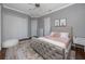 Bedroom with large bed, closet, and light grey colored walls, as well as a soft white chair at 1901 Carolina Ne Ave, St Petersburg, FL 33703