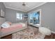 Comfortable bedroom with cozy decor and a sliding glass door to outside balcony with view at 1901 Carolina Ne Ave, St Petersburg, FL 33703