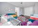 Bright bedroom with colorful decor, multiple beds, and connecting bathroom at 1901 Carolina Ne Ave, St Petersburg, FL 33703