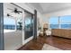 Bedroom with sliding glass doors to balcony with beautiful ocean view and a unique chair at 1901 Carolina Ne Ave, St Petersburg, FL 33703