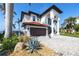Beautiful residence boasting a tile roof, paver driveway, and manicured landscaping at 1901 Carolina Ne Ave, St Petersburg, FL 33703