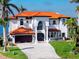Elegant home featuring a tile roof, a double-door entrance, and well-manicured front yard at 1901 Carolina Ne Ave, St Petersburg, FL 33703