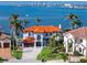 Stunning waterfront home with tile roof, lush landscaping, and views of the bay and city skyline at 1901 Carolina Ne Ave, St Petersburg, FL 33703