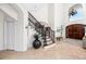 Inviting foyer with tile floors, elegant staircase, high ceilings, and decorative lighting at 1901 Carolina Ne Ave, St Petersburg, FL 33703