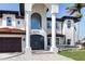 Grand entrance showcasing a tile roof, columns, and a striking double door at 1901 Carolina Ne Ave, St Petersburg, FL 33703