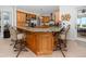 Open kitchen features granite counters, custom cabinets, stainless appliances, and breakfast bar at 1901 Carolina Ne Ave, St Petersburg, FL 33703