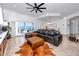 Spacious living room with water views, a ceiling fan, and access to a patio at 1901 Carolina Ne Ave, St Petersburg, FL 33703