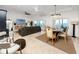 Open-concept living and dining area with waterfront views, tile floors, and stylish furnishings at 1901 Carolina Ne Ave, St Petersburg, FL 33703