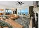 Spacious living room with water view, fireplace, stylish furnishings and plenty of natural light at 1901 Carolina Ne Ave, St Petersburg, FL 33703