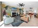 Living room with fireplace, stylish accent wall and furnishings, with seamless access to other living spaces at 1901 Carolina Ne Ave, St Petersburg, FL 33703