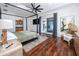 Large main bedroom with hardwood floors, wet bar, canopy bed, and doors to balcony at 1901 Carolina Ne Ave, St Petersburg, FL 33703