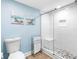 Modern bathroom with a glass-enclosed shower featuring pebble flooring and stylish fixtures at 19925 Gulf Blvd # 402, Indian Shores, FL 33785