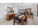 Inviting dining area featuring a dark wood table and chairs with a view of the bar at 19925 Gulf Blvd # 402, Indian Shores, FL 33785