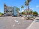 View of condo building, parking area and sign, 