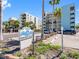 View of condo building and sign, 
