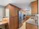 Spacious kitchen with stainless appliances, office nook, and granite countertops at 19925 Gulf Blvd # 402, Indian Shores, FL 33785