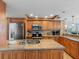 Well-equipped kitchen with custom cabinets, granite counters, and stainless steel appliances at 19925 Gulf Blvd # 402, Indian Shores, FL 33785