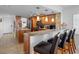 Kitchen with breakfast bar, granite countertops, stainless appliances and pendant lighting at 19925 Gulf Blvd # 402, Indian Shores, FL 33785