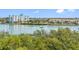 Scenic water view showcasing the complex and surrounding foliage on a sunny day at 19925 Gulf Blvd # 402, Indian Shores, FL 33785